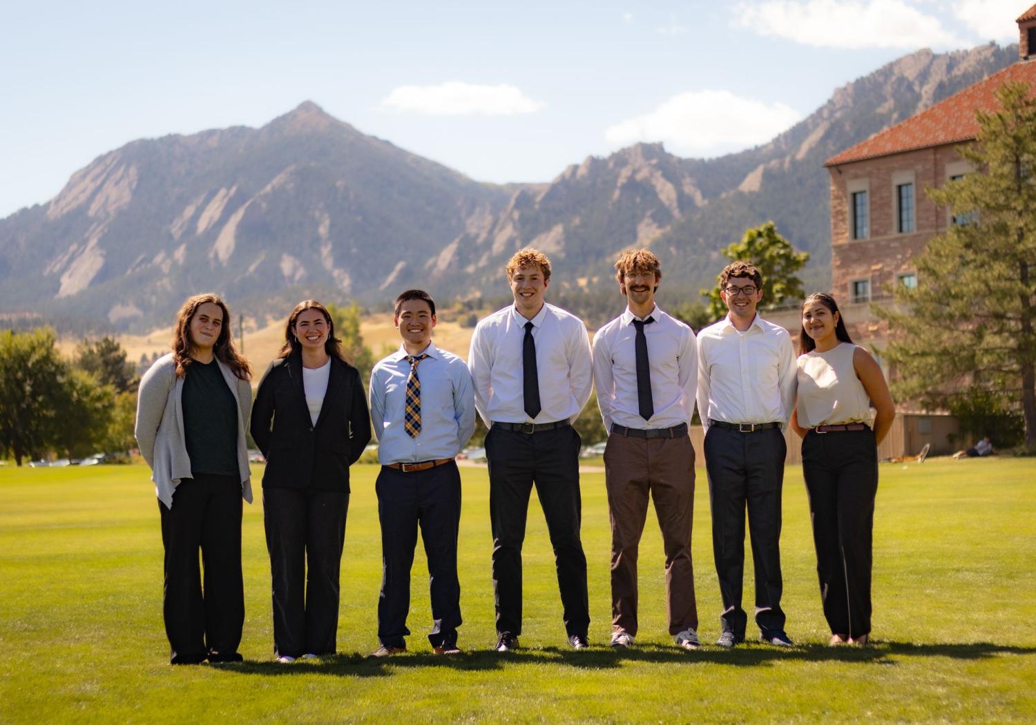 students posing for group photo outside