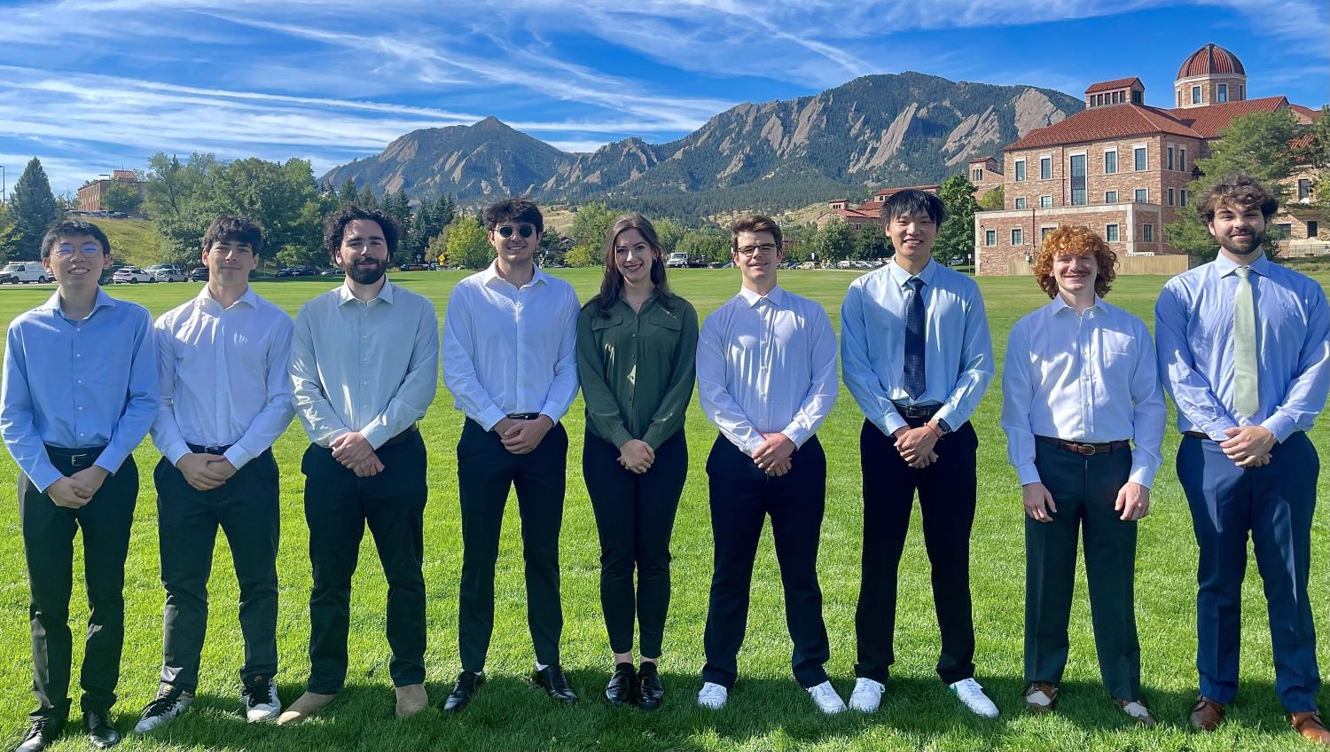 students posing for group photo outside