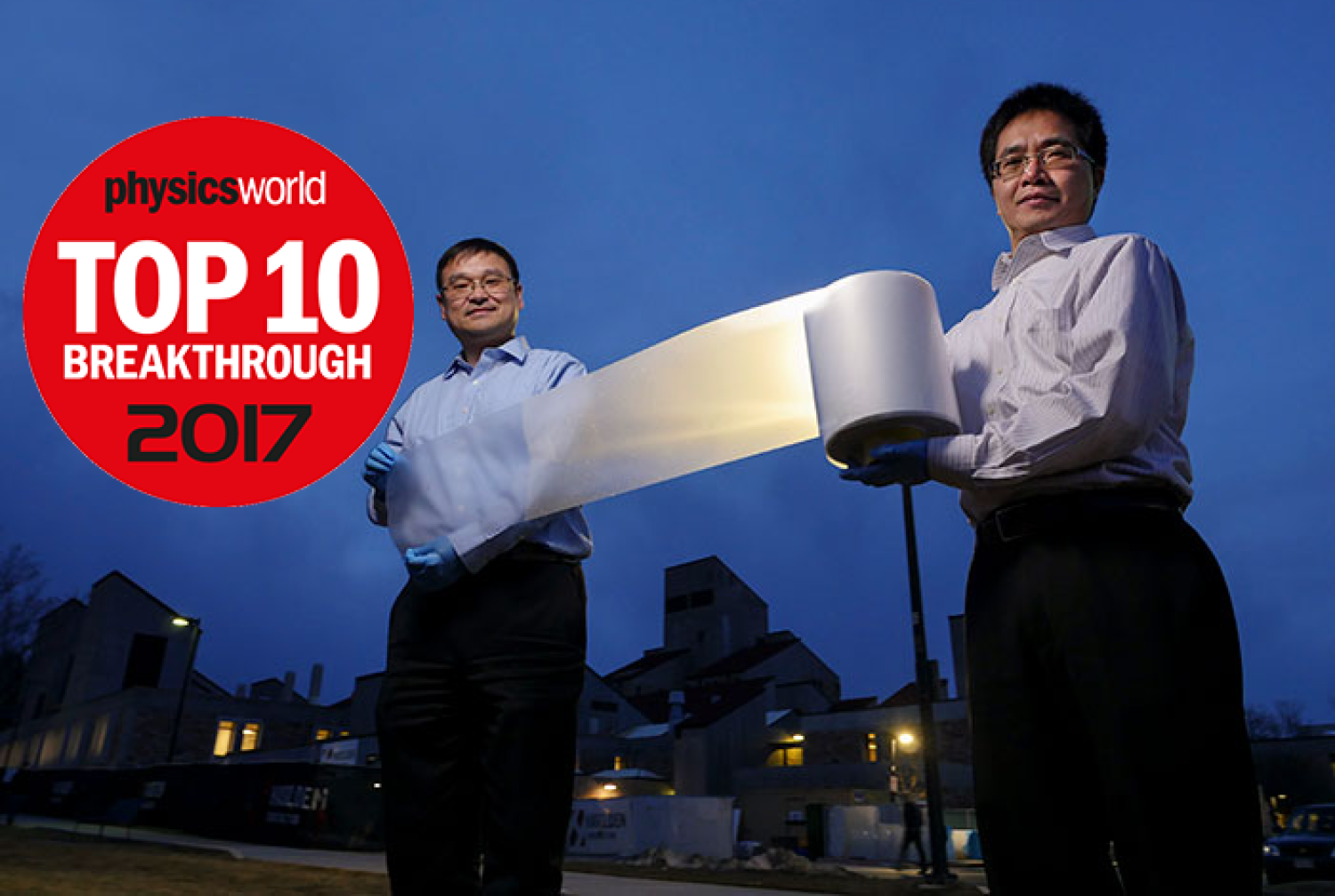 Ronggui Yang and Xiaobo Yin holding the metamaterial.