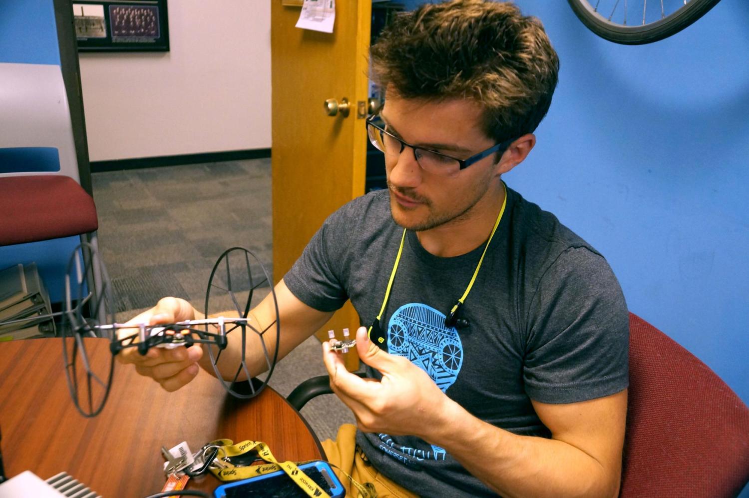 A student looking over a drone design.