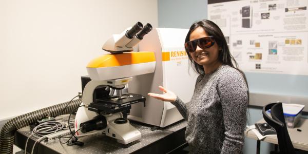 researcher with microscope