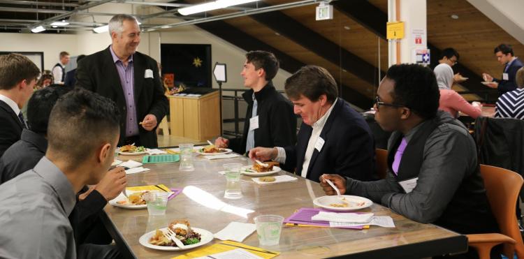 Students meeting with alumni.