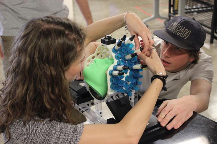 Two students working on the project.