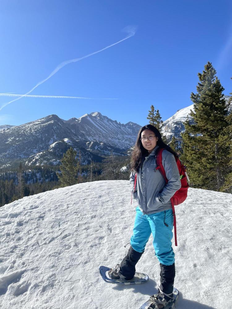 Kai Cui in snowshoes on hike