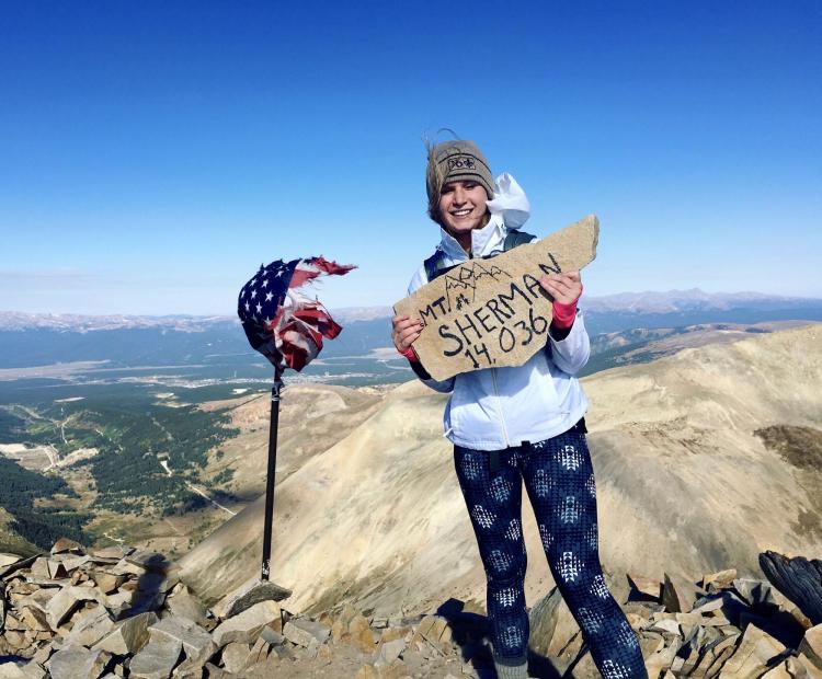 Morgan Kauss climbs a 14er