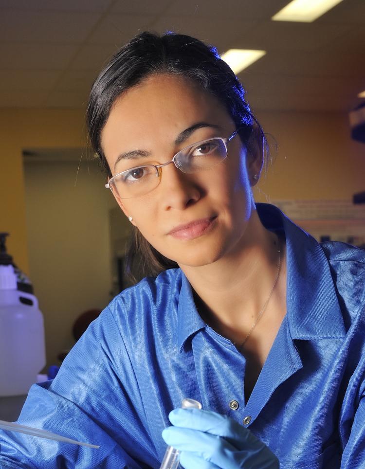 Marina Vance in a labcoat.