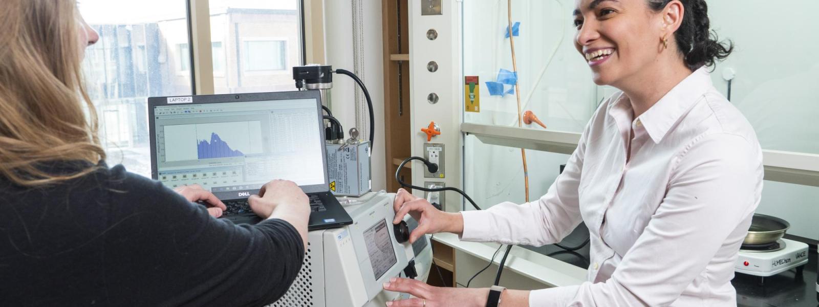 Marina Vance works on a project with a student in her lab