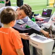 Teaching child at Engineering Projects Expo 2019