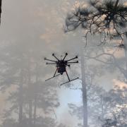 drone flies in smoke