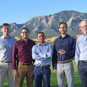 Victor Bright with his researchers in front of the Boulder Flatiron mountains.