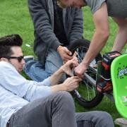 Students working on their vehicle.