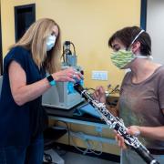 Shelly Miller working with student on clarinet 