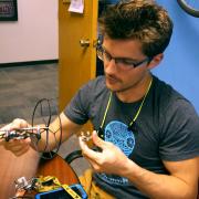 A student looking over a drone design.