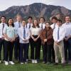Hydro team posing for group photo with flatirons behind them