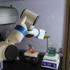 robots helping pour liquid in a chemistry wet lab