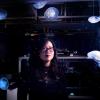 Nicole Xu portrait photo with black background and jellyfish circling her