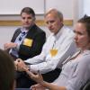 Three alumni speaking to a class