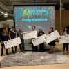 LVC winners hold up their novelty checks at the end of their showcase competition