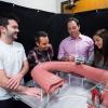 Mechanical engineering Associate Professor Mark Rentschler and three graduate students with an oversized version of a synthetic colon created as a senior design project. Rentschler is the lead scientist on a CU Boulder project to design a sophisticated robotic small intestine.
