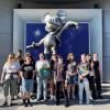 The oSTEM students in front of a Mickey Mouse statue at Disneyland