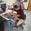 Working in the lab assembling a fin prototype