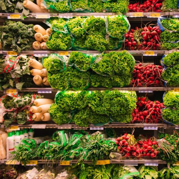 Photo of various vegetables at a grocery store.