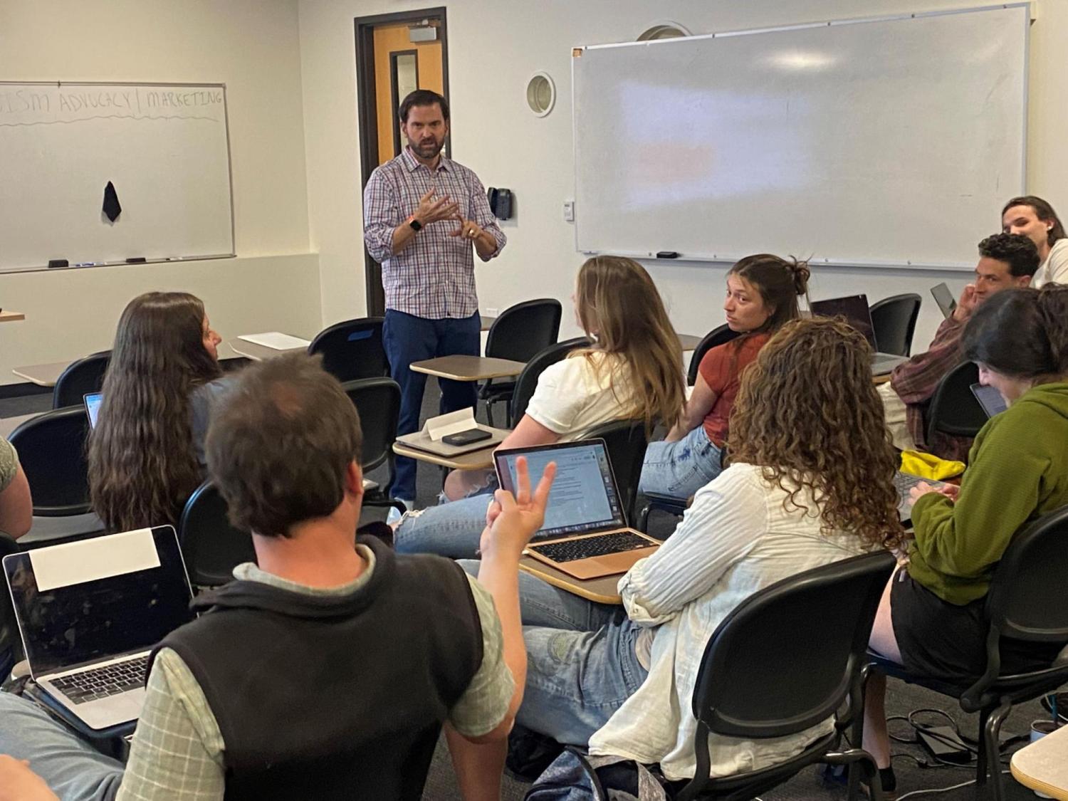 Luis Benitez teaching a group of students. 