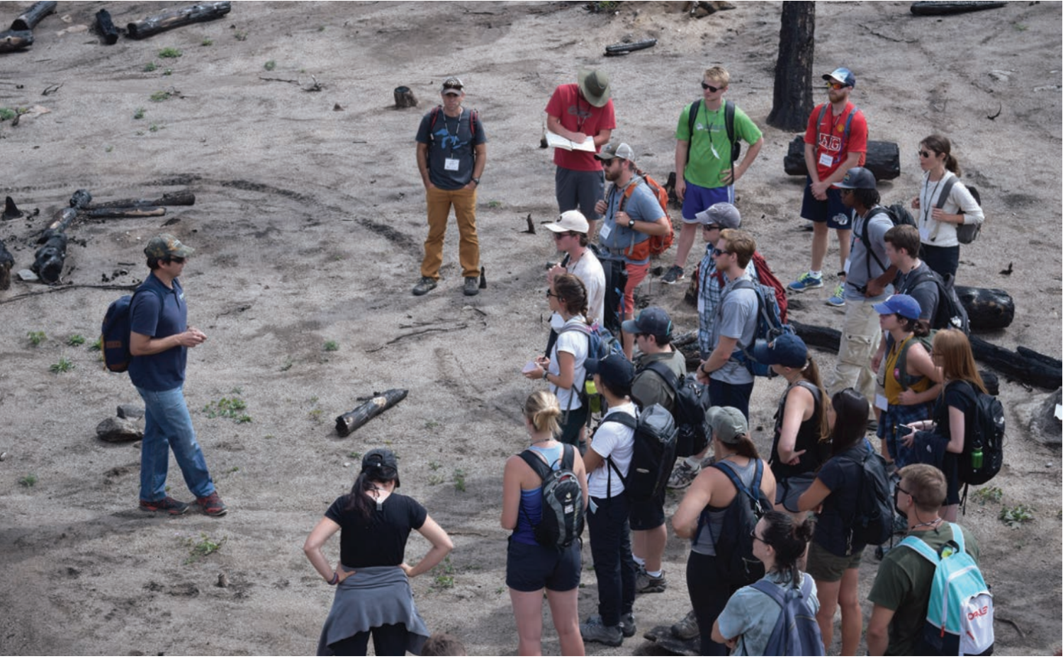 Students learning about wildfire as a former burn site