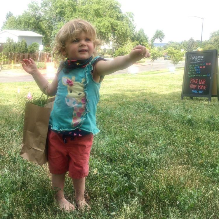 Kid at farm stand