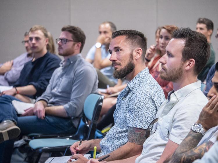 students listening to speaker