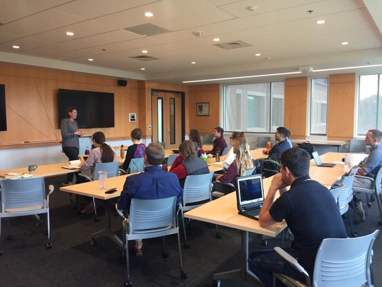 Speaker giving a presentation to students
