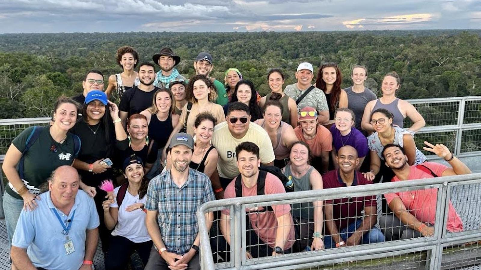 Group of students partaking in a sunset hike over the Amazon.