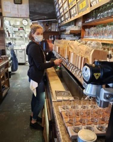 Bartender filling beer from a tap