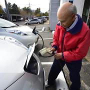 Saul Basri charges his electric car at Boulder Nissan on Oct. 23. Boulder County commissioners on Tuesday pledged to the eventual electrification of the county's entire vehicle fleet. (Paul Aiken / Staff Photographer)