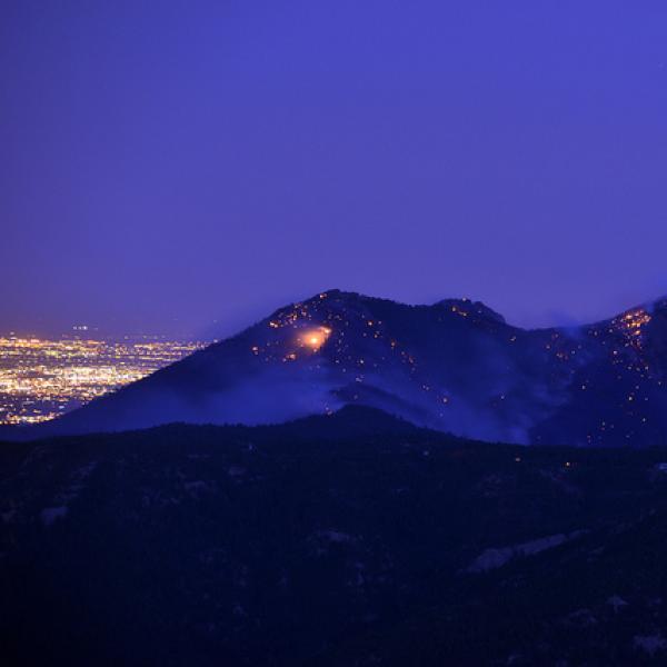 Fire smolders on Bear peak