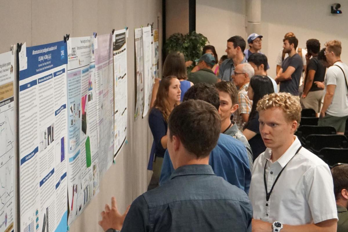 Attendees at the symposium poster session.