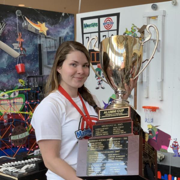 Demi Dayton posing with giant trophy