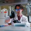 Cooper Thome, a doctoral candidate in the Department of Chemical and Biological Engineering, uses a new "acoustic pipette," which could someday be used to deliver swift test results at the bedside with only a finger-prick of blood.