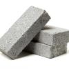Stacked grey cement bricks