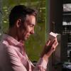 Wil Srubar holds a sample cube of concrete that contains biogenic limestone produced by calcifying macro- and microalgae.