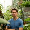 Elliot Strand in a greenhouse.