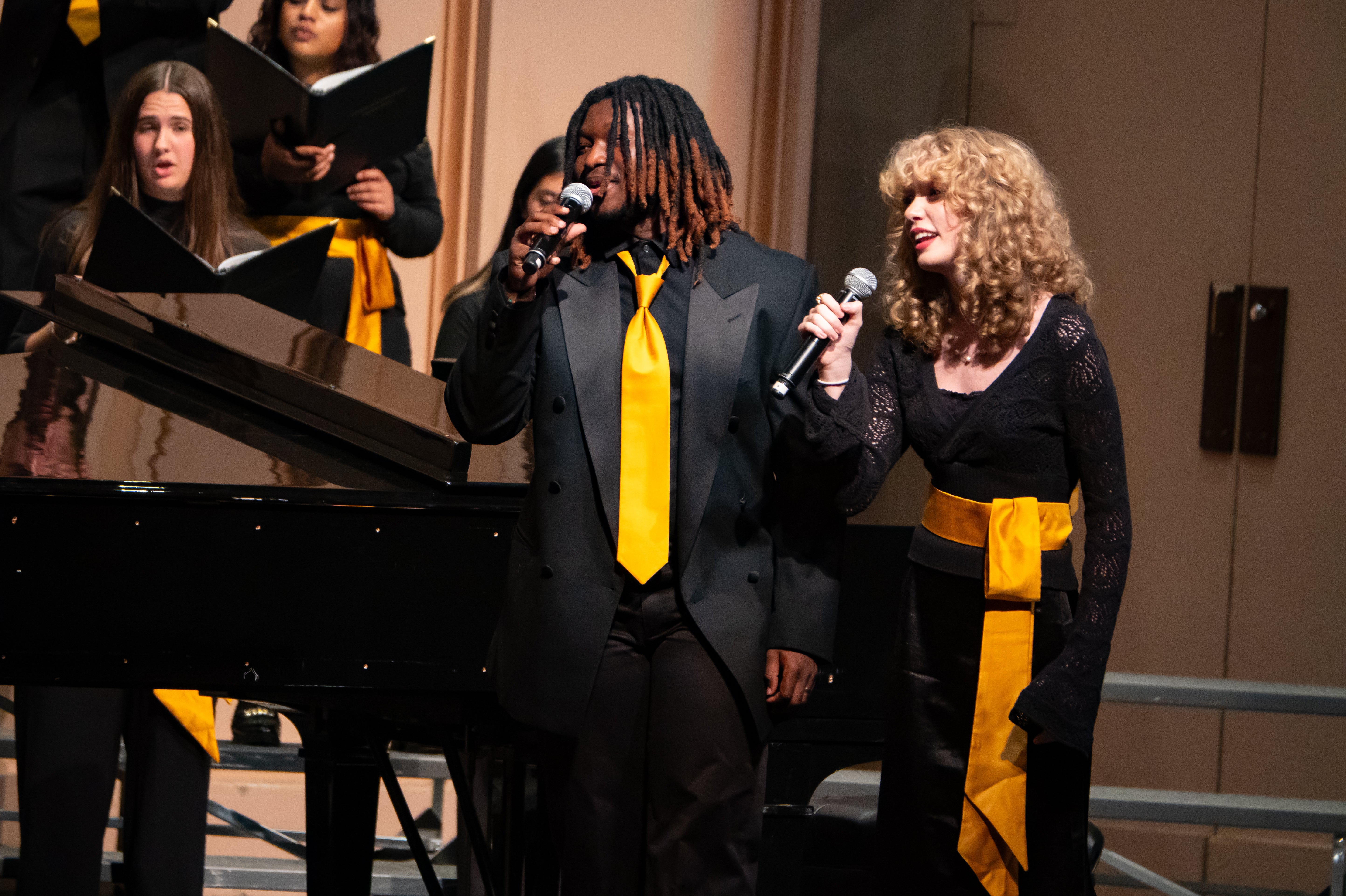 Close-up of two singers on stage at Macky Auditorium