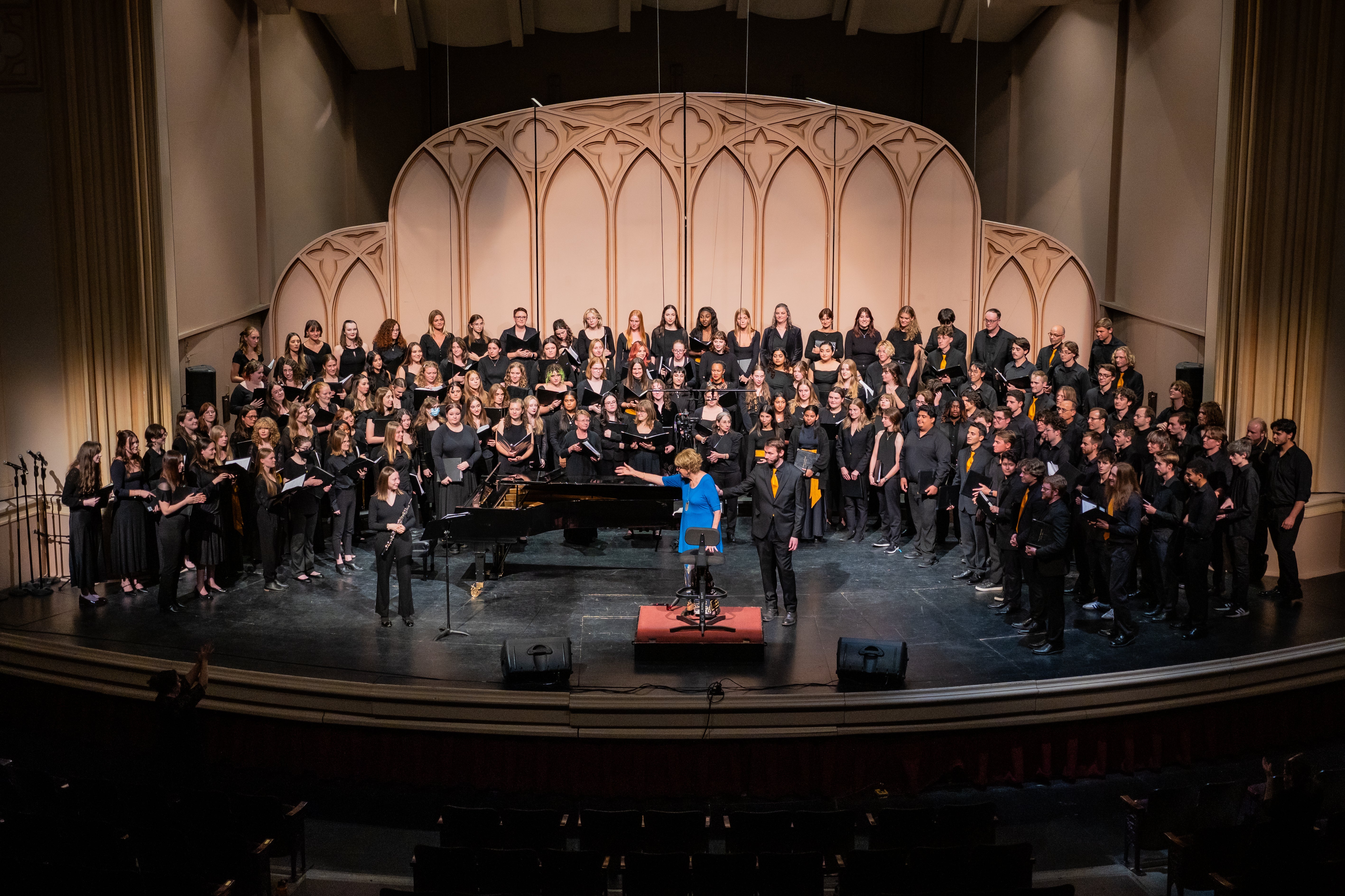 Choir on stage at Macky auditorium