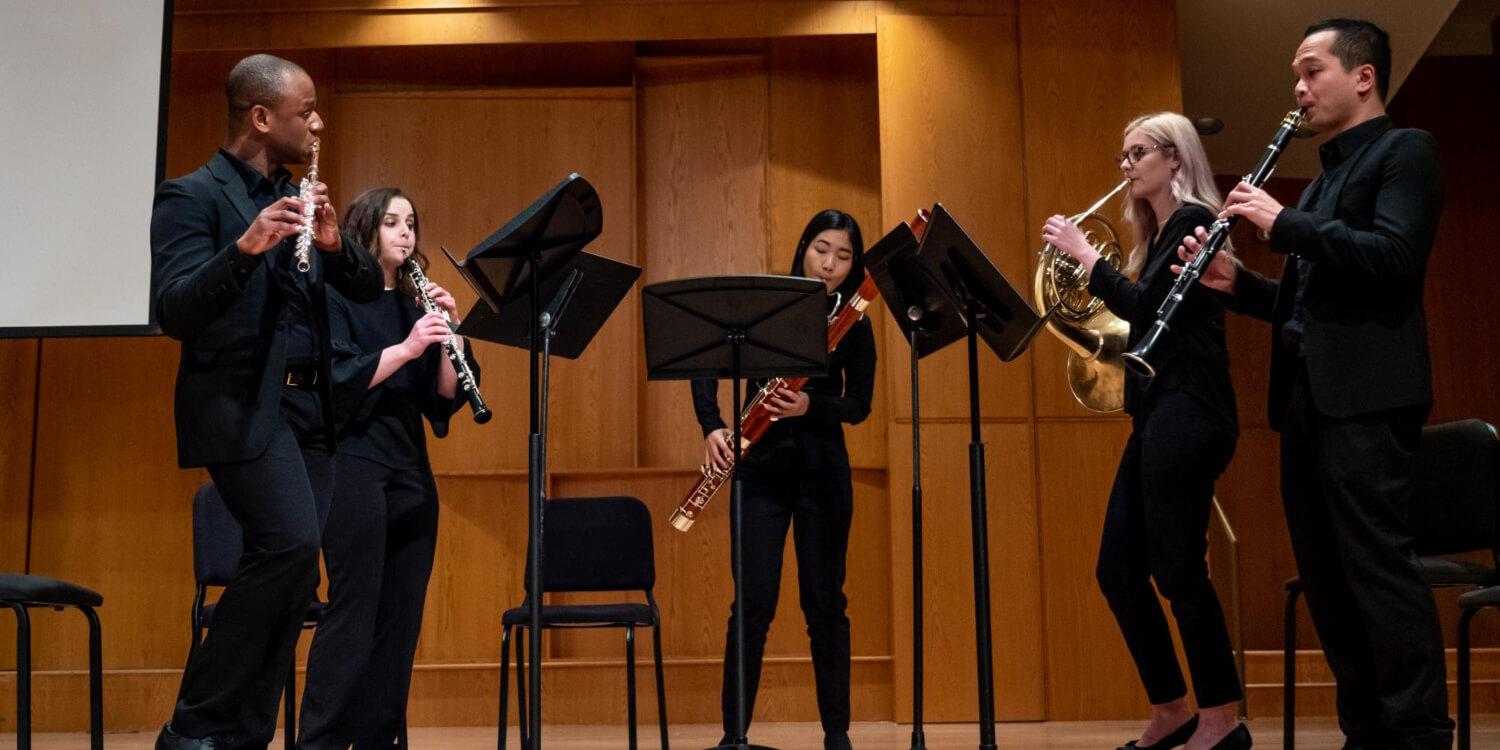 Students performing in Grusin Hall
