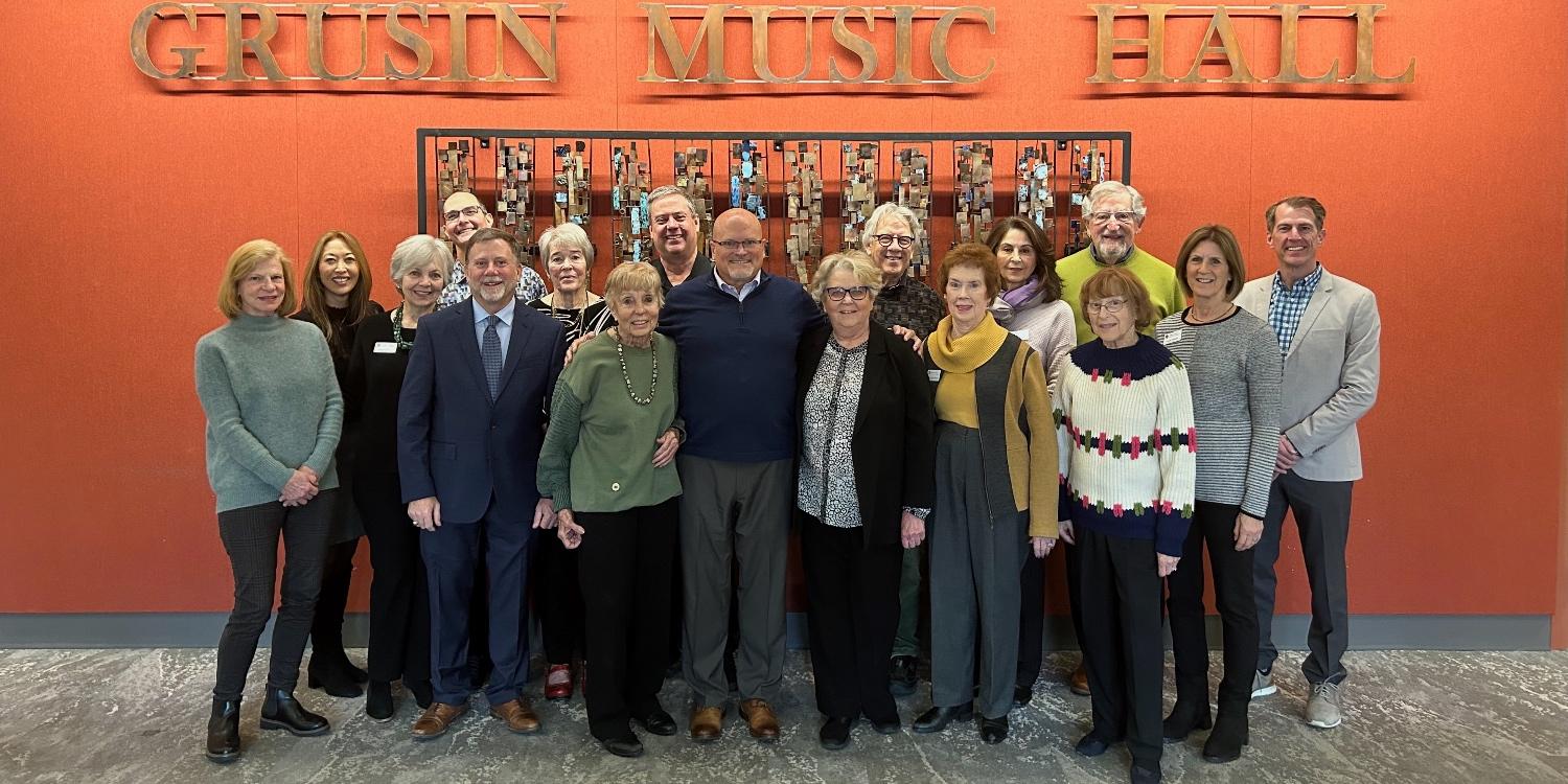 College of Music Advisory Board members in front of Grusin Music Hall