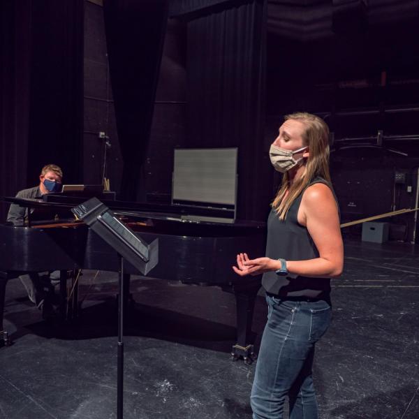 Student and faculty member wearing face masks