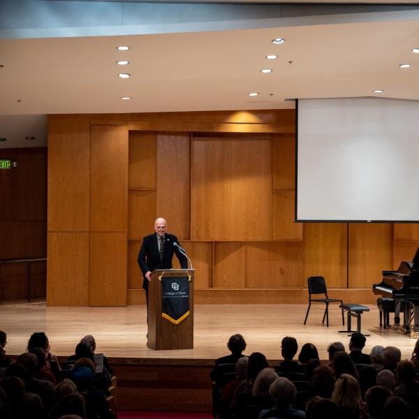 Dean Shay opens the program