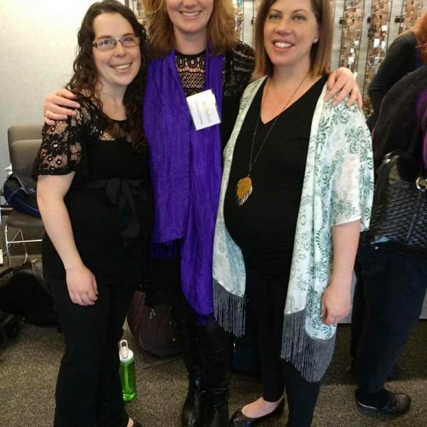 Christina Jennings poses with two flute alumni