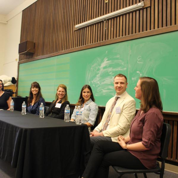 Alumni speak on a panel