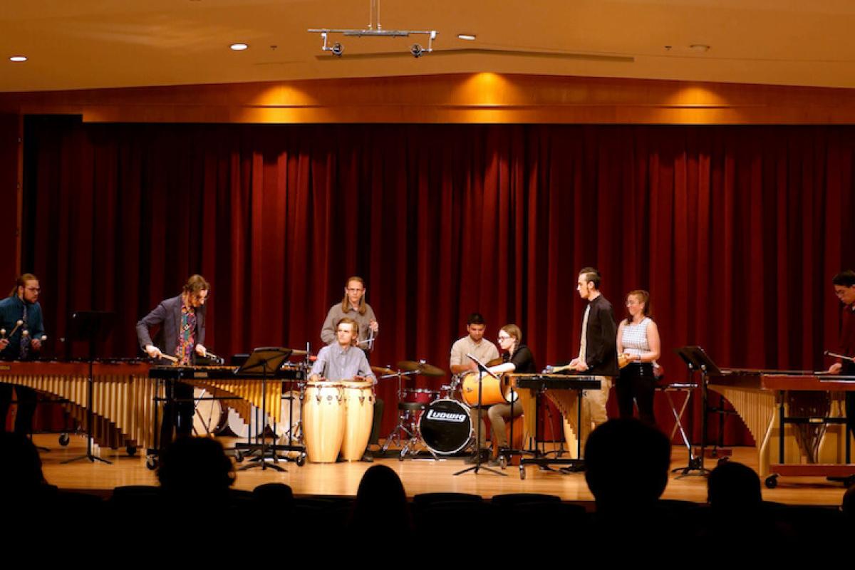 Percussion students on stage at Grusin Hall